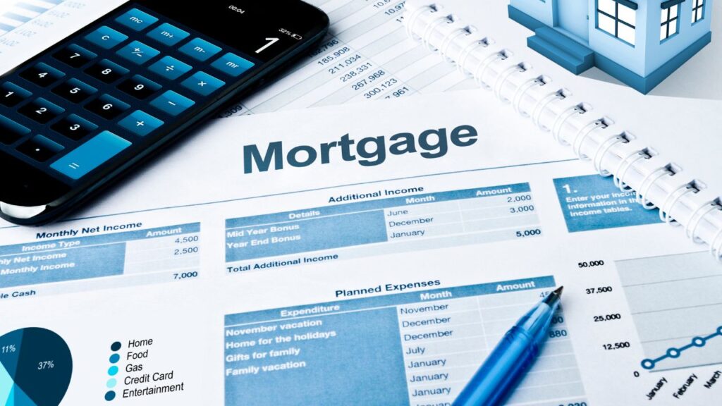 The image features a close-up view of a financial document labeled "Mortgage," with a calculator, a pen, and a miniature house model on top of the document. The document includes tables detailing monthly net income, additional income, and planned expenses. A pie chart and line graph are also visible, representing various expenditures and financial data.