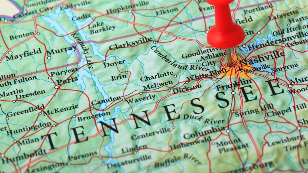 A close-up of a map highlighting Tennessee, with a red pushpin marking the location of Nashville. The map displays various cities, roads, and rivers in the surrounding region, including Clarksville, Franklin, and Dickson. The Cumberland River is visible, along with other geographic features.