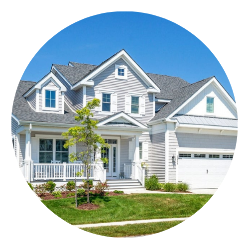 Gray two-story house with white trim, a front porch, and an attached garage.