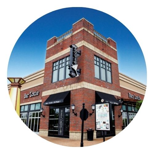 Two-story brick building with Bar Louie restaurant signage.