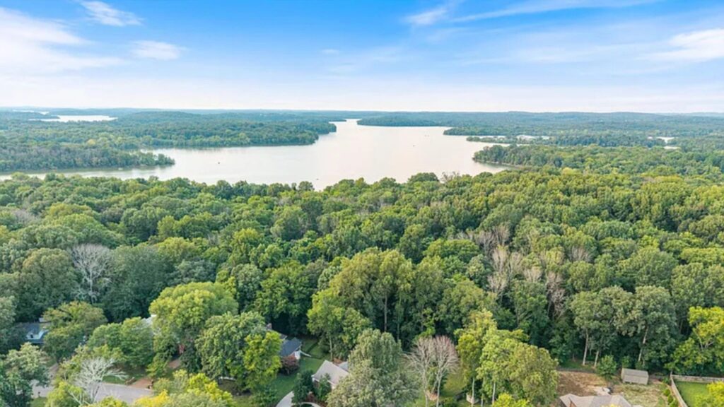 Aerial view of wooded land and nearby lake in Smyrna, Tennessee.