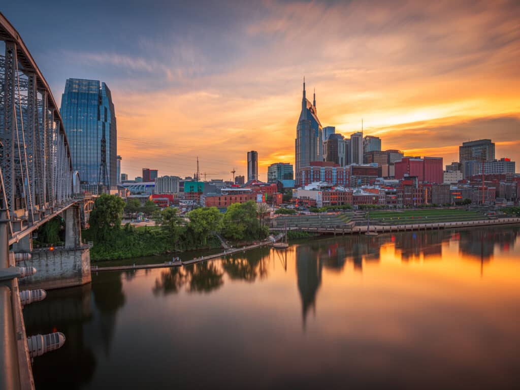 Downtown Nashville skyline along the Cumberland River at sunset